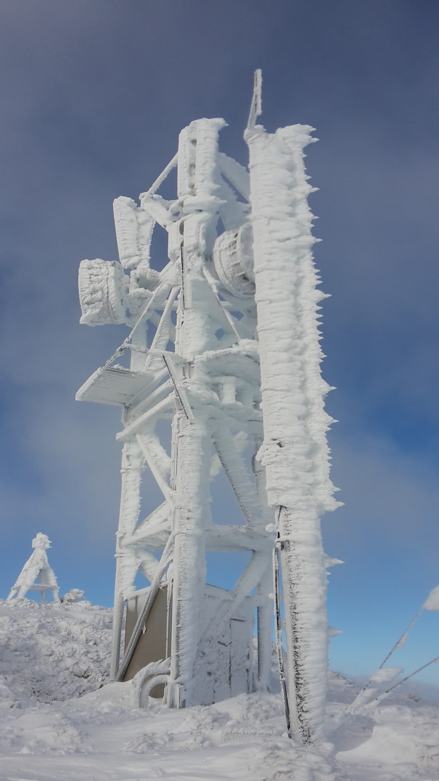 Electricity tower covered in snow