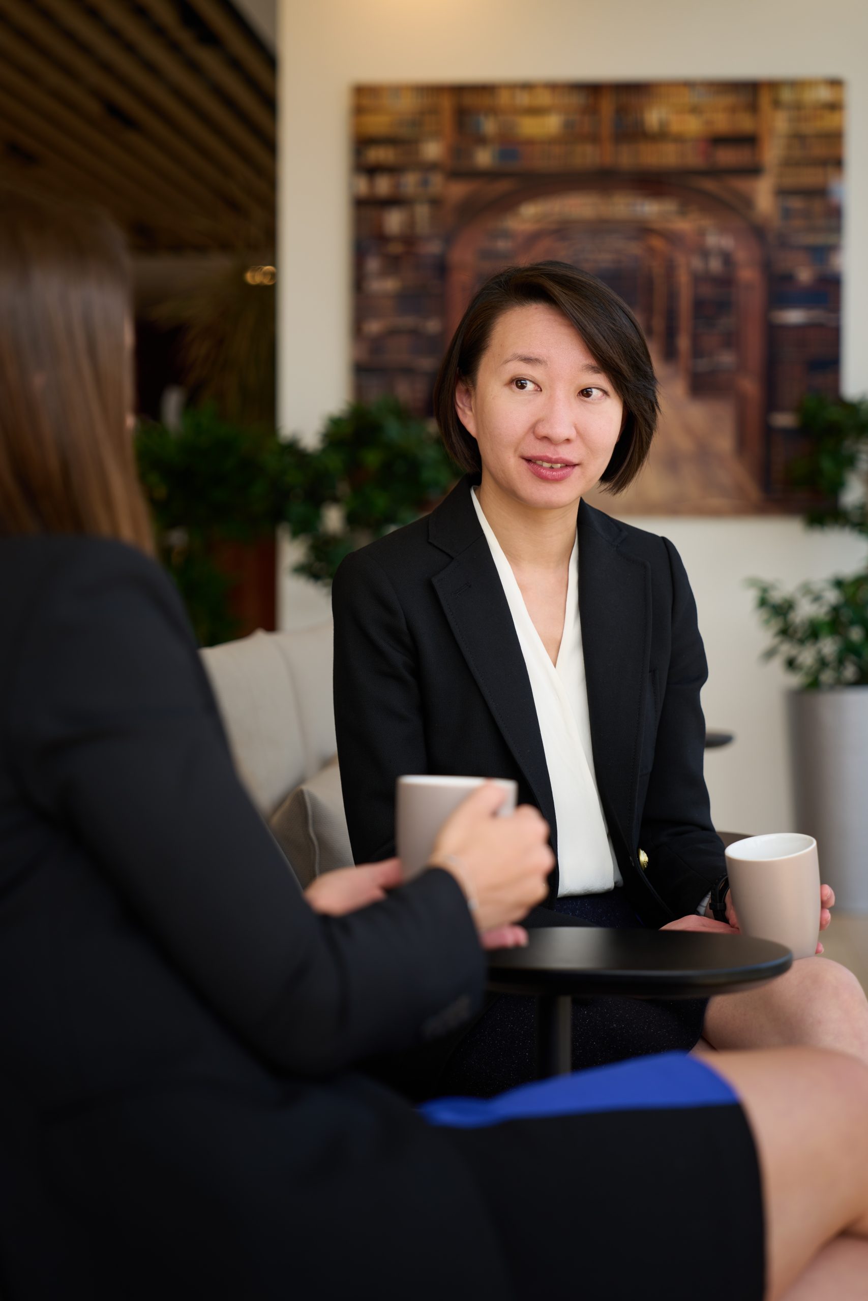 image of business woman talking to another woman
