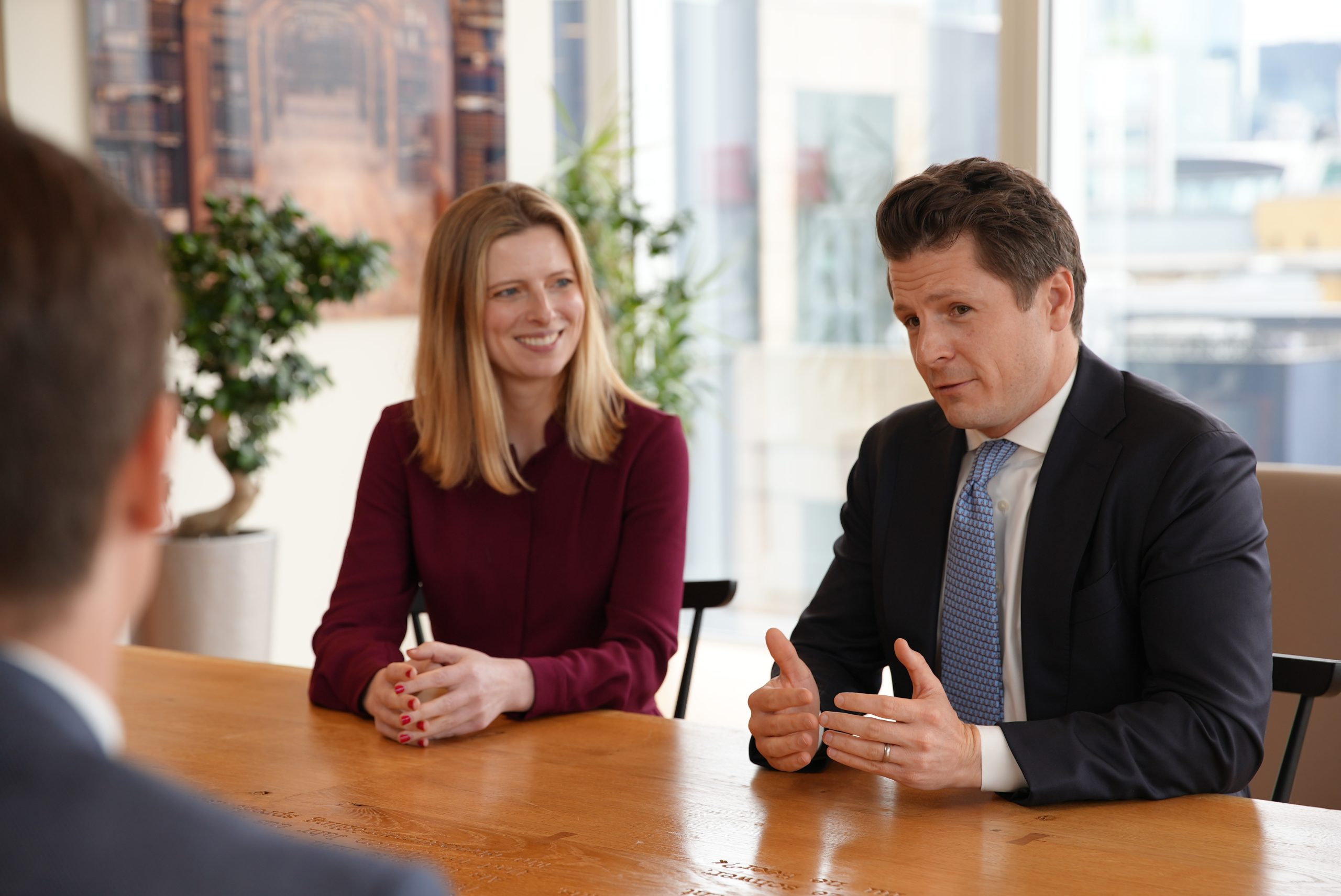 business people at table talking