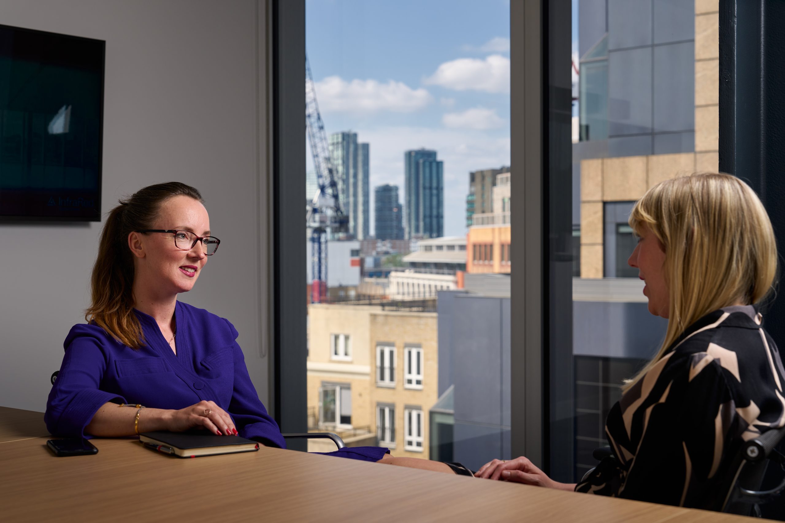 business women talking at table