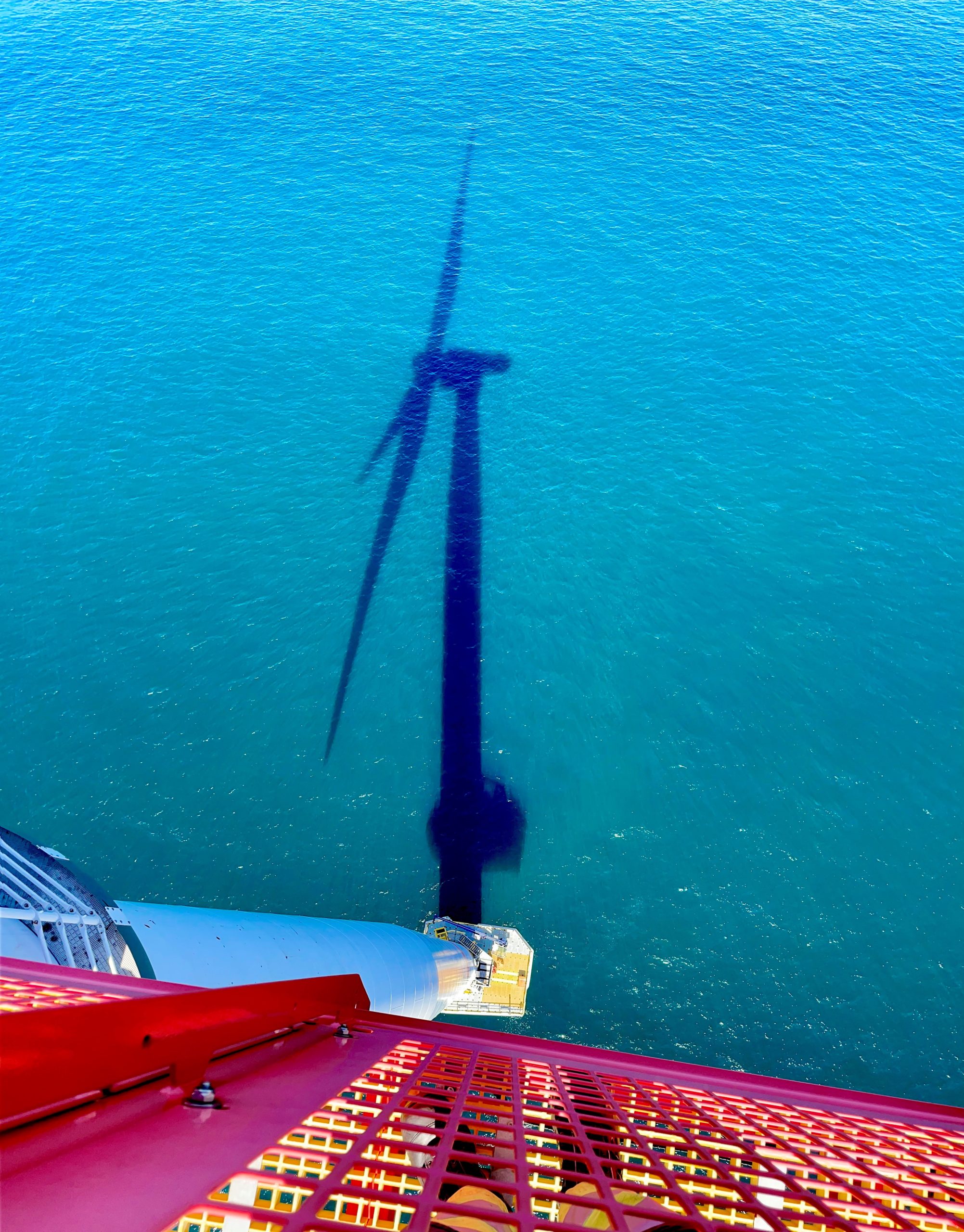 shadow of wind turbine at sea