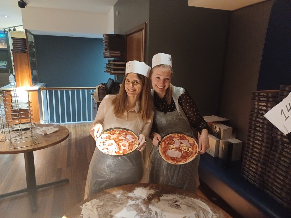 InfraRed employees making pizza