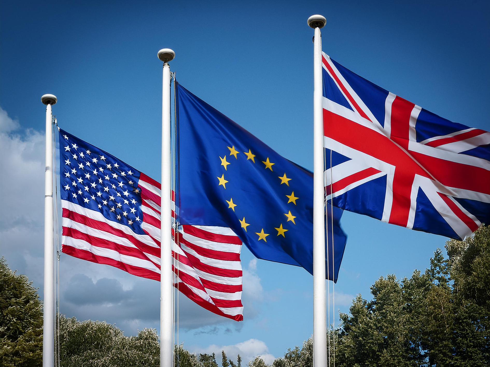 The flags of the US, European Union and the UK.